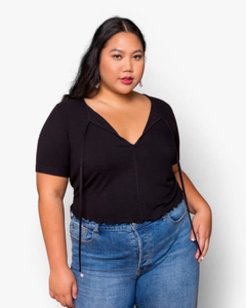 Front of a model wearing a size XL Angela Pearl-Drop Tee in Black by Lovefool. | dia_product_style_image_id:249536